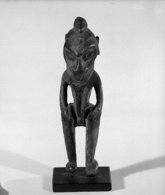  <em>Figure</em>. Wood, 4 3/4 x 1 3/8 x 1 3/8 in. (12.1 x 3.5 x 3.5 cm). Brooklyn Museum, Gift of Marcia and John Friede and Mrs. Melville W. Hall, 87.218.36. Creative Commons-BY (Photo: Brooklyn Museum, 87.218.36_front_bw.jpg)