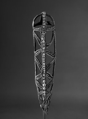 Iatmul. <em>Bridal Cape</em>. Woven fiber, nassa and cowrie shells, 36 1/2 x 6 1/2 x 7 1/2 in. (92.7 x 16.5 x 19.1 cm). Brooklyn Museum, Gift of Marcia and John Friede and Mrs. Melville W. Hall, 87.218.65. Creative Commons-BY (Photo: Brooklyn Museum, 87.218.65_bw.jpg)