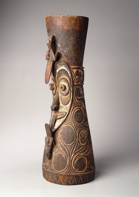 Iatmul. <em>Drum</em>, early 20th century. Wood, shell, pigment, 26 1/4 x 7 1/2 x 9 in. (66.7 x 19.1 x 22.9 cm). Brooklyn Museum, Gift of Marcia and John Friede and Mrs. Melville W. Hall, 87.218.70a-b. Creative Commons-BY (Photo: Brooklyn Museum, 87.218.70_SL1.jpg)