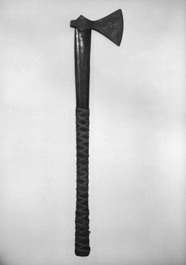 Kanak. <em>Axe</em>. Metal, wood, fiber, coir, 25 3/8 x 5 13/16 in. (64.5 x 14.8 cm). Brooklyn Museum, Gift of Marcia and John Friede and Mrs. Melville W. Hall, 87.218.86. Creative Commons-BY (Photo: Brooklyn Museum, 87.218.86_bw.jpg)