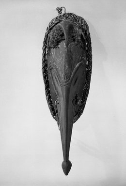  <em>Mask</em>, 20th century. Wood, fiber, pigment, shell, 13 1/4 x 5 x 3 1/8 in. (33.7 x 12.7 x 7.9 cm). Brooklyn Museum, Gift of Marcia and John Friede and Mrs. Melville W. Hall, 87.218.8. Creative Commons-BY (Photo: Brooklyn Museum, 87.218.8_bw.jpg)