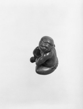  <em>Netsuke in the Form of a Man Applying Moxa</em>, 19th century. Carved boxwood and ivory, 1 1/2 x 1 in. (3.8 x 2.5 cm). Brooklyn Museum, Gift of Maybelle M. Dore, 87.228.2. Creative Commons-BY (Photo: Brooklyn Museum, 87.228.2_bw.jpg)