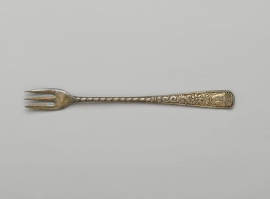1847 Rogers Brothers. <em>Fork, Assyrian Head Pattern</em>, Patented 1886. Silverplate, 6 1/4 x 5/8 x 1/4 in. (15.9 x 1.6 x 0.6 cm). Brooklyn Museum, Gift of Joseph V. Garry, 88.104.4. Creative Commons-BY (Photo: Brooklyn Museum, 88.104.4_PS2.jpg)