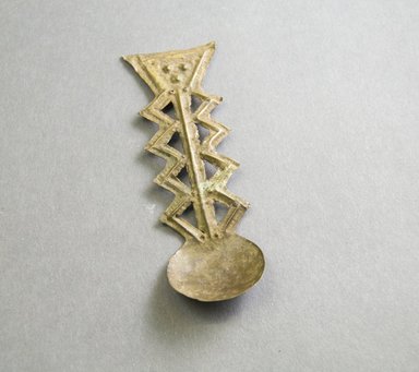 Akan. <em>Gold Dust Spoon</em>, 19th-20th century. Hammered brass, 4 3/8 x 1 1/2 in. Brooklyn Museum, Gift of Mr. and Mrs. Franklin H. Williams, 88.192.25. Creative Commons-BY (Photo: Brooklyn Museum, 88.192.25_front_PS5.jpg)