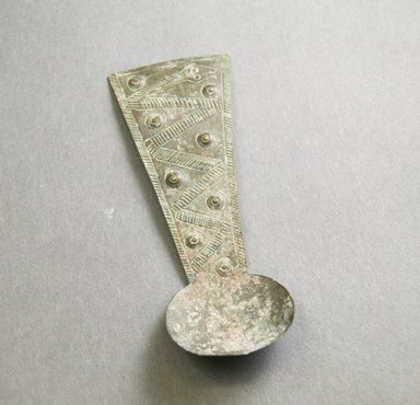 Akan. <em>Gold Dust Spoon</em>, 19th-20th century. Hammered brass, 4 1/2 x 1 3/4 in. Brooklyn Museum, Gift of Mr. and Mrs. Franklin H. Williams, 88.192.26. Creative Commons-BY (Photo: Brooklyn Museum, 88.192.26_front_PS5.jpg)