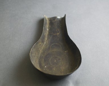 Akan. <em>Gold Dust Spoon</em>, 19th-20th century. Hammered brass, 5 1/2 x 3 1/4 x 1 1/2 in. Brooklyn Museum, Gift of Mr. and Mrs. Franklin H. Williams, 88.192.29. Creative Commons-BY (Photo: Brooklyn Museum, 88.192.29_front_PS5.jpg)