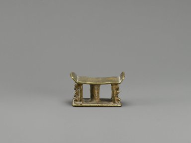 Akan. <em>Gold-weight (abrammuo): stool</em>, 19th–20th century. Cast brass, 1 1/4 x 5/8 x 7/8 in. Brooklyn Museum, Gift of Mr. and Mrs. Franklin H. Williams, 88.192.37. Creative Commons-BY (Photo: Brooklyn Museum, 88.192.37_PS6.jpg)