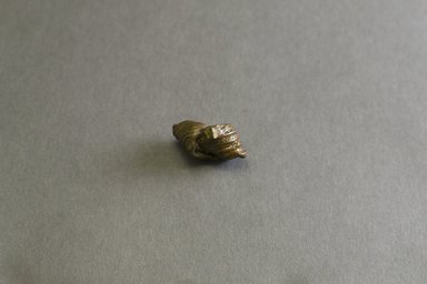 Akan. <em>Gold-weight (abrammuo): knot</em>, 19th-20th century. Copper alloy, 1 x 5/8 x 1/2 in. Brooklyn Museum, Gift of Mr. and Mrs. Franklin H. Williams, 88.192.39. Creative Commons-BY (Photo: Brooklyn Museum, 88.192.39_front_PS5.jpg)