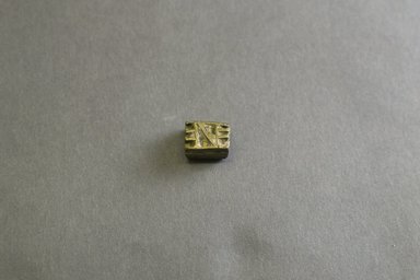 Akan. <em>Gold-weight (abrammuo): geometric</em>, 19th-20th century. Copper alloy, 1/2 x 3/8 x 1/4in. (1.3 x 1 x 0.6cm). Brooklyn Museum, Gift of Mr. and Mrs. Franklin H. Williams, 88.192.40. Creative Commons-BY (Photo: Brooklyn Museum, 88.192.40_front_PS5.jpg)