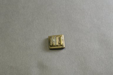 Akan. <em>Gold-weight (abrammuo): geometric</em>, 19th-20th century. Copper alloy, 1/4 x 3/4 x 5/8 in. Brooklyn Museum, Gift of Mr. and Mrs. Franklin H. Williams, 88.192.45. Creative Commons-BY (Photo: Brooklyn Museum, 88.192.45_front_PS5.jpg)