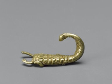 Akan. <em>Gold-weight (abrammuo): scorpion</em>, 19th-20th century. Cast brass, 1 1/4 x 1/8in. (3.2 x 0.3cm). Brooklyn Museum, Gift of Mr. and Mrs. Franklin H. Williams, 88.192.66. Creative Commons-BY (Photo: Brooklyn Museum, 88.192.66_PS6.jpg)
