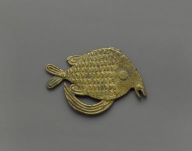 Akan. <em>Gold-weight (abrammuo): fish</em>, 19th-20th century. Cast brass, 2 1/4 x 1 5/8 in. (5.7 x 4.1 cm). Brooklyn Museum, Gift of Mr. and Mrs. Franklin H. Williams, 88.192.70. Creative Commons-BY (Photo: Brooklyn Museum, 88.192.70_PS6.jpg)