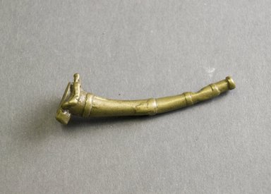 Akan. <em>Gold-weight (abrammuo): side-blown horn</em>, 19th-20th century. Copper alloy, 2 1/4 x 5/8 in. (5.7 x 1.6 cm). Brooklyn Museum, Gift of Mr. and Mrs. Franklin H. Williams, 88.192.73. Creative Commons-BY (Photo: Brooklyn Museum, 88.192.73_front_PS5.jpg)