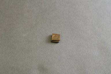 Akan. <em>Gold-weight (abrammuo): geometric</em>, 19th-20th century. Copper alloy, 3/8 x 3/8 x 1/8 in. Brooklyn Museum, Gift of Mr. and Mrs. Franklin H. Williams, 88.192.98. Creative Commons-BY (Photo: Brooklyn Museum, 88.192.98_front_PS5.jpg)
