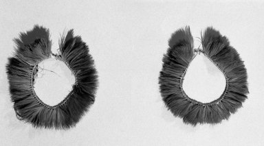 Kaapor. <em>Pair of Ear Ornaments</em>, 20th century. Feathers, fiber, 3 × 3 × 1/4 in. (7.6 × 7.6 × 0.6 cm). Brooklyn Museum, Anonymous gift, 88.89.2a-b. Creative Commons-BY (Photo: Brooklyn Museum, 88.89.2a-b_acetate_bw.jpg)