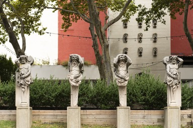  <em>Atlante, one of four, from Hugh J. Chisholm Mansion, 813 Fifth Avenue, NYC</em>, ca. 1899. Limestone, 72 x 18 x 18 in. (182.9 x 45.7 x 45.7 cm). Brooklyn Museum, Gift of Anonymous Arts Recovery Society, 65.130.1. Creative Commons-BY (Photo: Photo: Paula Abreu Pita, BkM_exterior_Sculpture_Garden_20240910_DIG_06_Paula_Abreu_Pita_PS22.jpg)