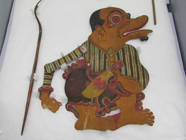  <em>Shadow Play Figure (Wayang kulit)</em>, before 1893. Leather, pigment, wood, fiber, metal, 11 7/16 × 13 3/8 in. (29 × 34 cm). Brooklyn Museum, Brooklyn Museum Collection, 00.1. Creative Commons-BY (Photo: , CUR.00.1_overall.jpg)