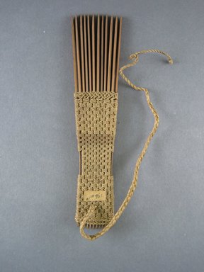  <em>Comb</em>. Light brown reed Brooklyn Museum, Brooklyn Museum Collection, 00.99.10. Creative Commons-BY (Photo: Brooklyn Museum, CUR.00.99.10_view1.jpg)