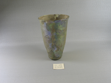 Roman. <em>Beaker of Blown Glass</em>, 1st century B.C.E. - 2nd century C.E. Glass, 5 7/16 x greatest diam. 3 3/4 in. (13.8 x 9.6 cm). Brooklyn Museum, Gift of Robert B. Woodward, 01.113. Creative Commons-BY (Photo: Brooklyn Museum, CUR.01.113_view1.jpg)