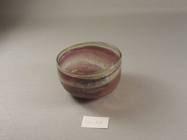 Roman. <em>Bowl of Blown Glass</em>, 1st-4th century C.E. Glass, 2 5/16 x greatest diam. 4 in. (5.9 x 10.2 cm). Brooklyn Museum, Gift of Robert B. Woodward, 01.133. Creative Commons-BY (Photo: Brooklyn Museum, CUR.01.133.jpg)