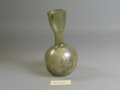 Roman. <em>Bottle of Blown Glass</em>, 1st-5th century C.E. Glass, 4 9/16 x Diam. 2 1/2 in. (11.6 x 6.4 cm). Brooklyn Museum, Gift of Robert B. Woodward, 01.140. Creative Commons-BY (Photo: Brooklyn Museum, CUR.01.140_view2.jpg)