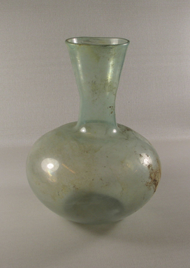 Roman. <em>Decanter of Plain Blown Glass</em>, 1st-5th century C.E. Glass, 9 1/2 x greatest diam. 7 5/16 in. (24.2 x 18.5 cm). Brooklyn Museum, Gift of Robert B. Woodward, 01.159. Creative Commons-BY (Photo: Brooklyn Museum, CUR.01.159_view1.jpg)