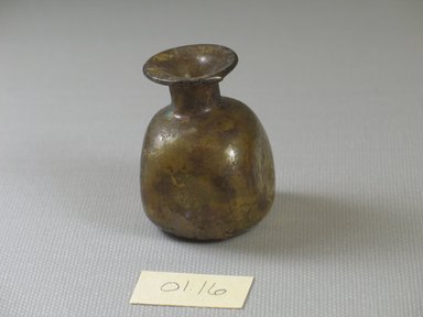 Roman. <em>Bottle of Blown Glass</em>, 3rd-4th century C.E. Glass, 1 11/16 x 1 5/16 x 1 5/16 in. (4.3 x 3.3 x 3.4 cm). Brooklyn Museum, Gift of Robert B. Woodward, 01.16. Creative Commons-BY (Photo: Brooklyn Museum, CUR.01.16_view1.jpg)