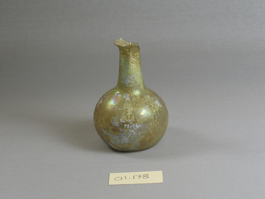 Roman. <em>Bottle</em>, 1st century C.E. Glass, 3 3/16 x Diam. 2 1/4 in. (8.1 x 5.7 cm). Brooklyn Museum, Gift of Robert B. Woodward, 01.178. Creative Commons-BY (Photo: Brooklyn Museum, CUR.01.178.jpg)