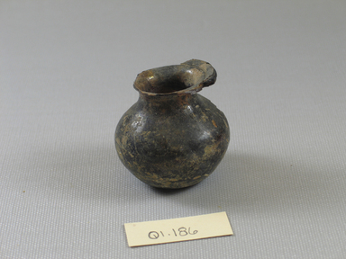 Roman. <em>Small Vase of Plain Blown Deep Amethyst Glass</em>, 4th-12th century C.E. Glass, 1 5/8 x Diam. 1 3/4 in. (4.2 x 4.4 cm). Brooklyn Museum, Gift of Robert B. Woodward, 01.186. Creative Commons-BY (Photo: Brooklyn Museum, CUR.01.186_view1.jpg)