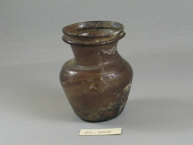 Roman. <em>Vase of Plain Blown Amethyst Glass</em>, 2nd century C.E. Glass, 3 7/16 x Diam. 2 13/16 in. (8.7 x 7.1 cm). Brooklyn Museum, Gift of Robert B. Woodward, 01.250. Creative Commons-BY (Photo: Brooklyn Museum, CUR.01.250_view1.jpg)