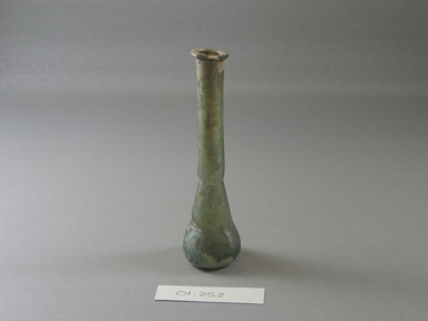 Roman. <em>Perfume Bottle of Plain Blown Glass</em>, 1st-2nd century C.E. Glass, Greatest diam. 1 1/8 x 4 5/16 in. (2.9 x 10.9 cm). Brooklyn Museum, Gift of Robert B. Woodward, 01.252. Creative Commons-BY (Photo: Brooklyn Museum, CUR.01.252_view1.jpg)