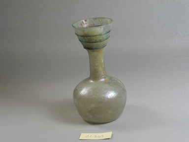 Roman. <em>Bottle of Plain Blown Glass</em>, 4th-5th century C.E. Glass, 4 15/16 x Diam. 2 11/16 in. (12.5 x 6.8 cm). Brooklyn Museum, Gift of Robert B. Woodward, 01.269. Creative Commons-BY (Photo: Brooklyn Museum, CUR.01.269.jpg)