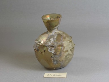 Roman. <em>Bottle of Blown Glass</em>, 3rd-9th century C.E. Glass, 3 1/2 x Diam. 2 15/16 in. (8.9 x 7.4 cm)  . Brooklyn Museum, Gift of Robert B. Woodward, 01.286. Creative Commons-BY (Photo: Brooklyn Museum, CUR.01.286.jpg)