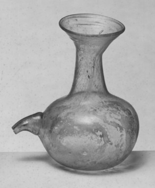 Roman. <em>Bottle of Plain Blown Glass</em>, 5th century C.E. Glass, 4 7/16 x 4 in. (11.3 x 10.2 cm). Brooklyn Museum, Gift of Robert B. Woodward, 01.287. Creative Commons-BY (Photo: Brooklyn Museum, CUR.01.287_negA_bw.jpg)