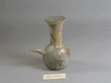 Roman. <em>Pouring Flask</em>, 3rd century C.E. Glass, 3 3/8 x Width 2 3/4 in. (8.6 x 7 cm). Brooklyn Museum, Gift of Robert B. Woodward, 01.289. Creative Commons-BY (Photo: Brooklyn Museum, CUR.01.289.jpg)