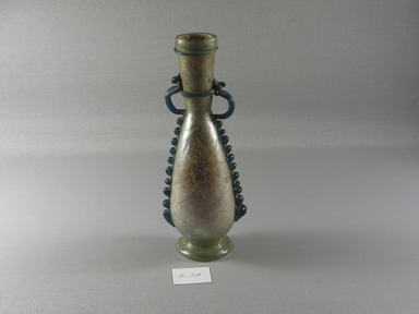 Roman. <em>Flask with Thread and Ribbon Decoration and Neck Handles</em>, 4th century C.E. Glass, 7 3/8 x 2 15/16 in. (18.7 x 7.4 cm). Brooklyn Museum, Gift of Robert B. Woodward, 01.28. Creative Commons-BY (Photo: Brooklyn Museum, CUR.01.28_view1.jpg)