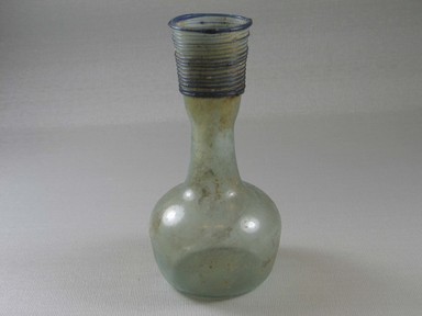 Roman. <em>Decanter of Plain Blown Glass</em>, 4th-5th century C.E. Glass, 5 1/2 x Diam. 2 3/4 in. (13.9 x 7 cm). Brooklyn Museum, Gift of Robert B. Woodward, 01.295. Creative Commons-BY (Photo: Brooklyn Museum, CUR.01.295_view1.jpg)