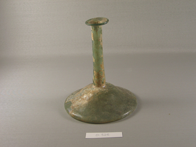 Roman. <em>Candlestick Bottle of Pale Blue-green Blown Glass</em>, 1st-12th century C.E. Glass, 7 1/16 x greatest diam. 6 1/2 in. (18 x 16.5 cm). Brooklyn Museum, Gift of Robert B. Woodward, 01.325. Creative Commons-BY (Photo: Brooklyn Museum, CUR.01.325_view1.jpg)
