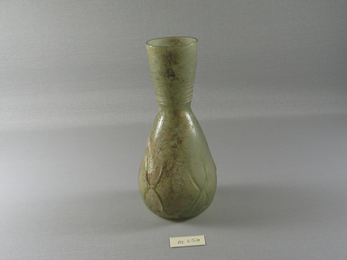 Roman. <em>Decanter of Blown Glass</em>, 3rd-5th century C.E. Glass, 6 5/8 x Diam. 3 1/8 in. (16.8 x 7.9 cm). Brooklyn Museum, Gift of Robert B. Woodward, 01.350. Creative Commons-BY (Photo: Brooklyn Museum, CUR.01.350_view1.jpg)