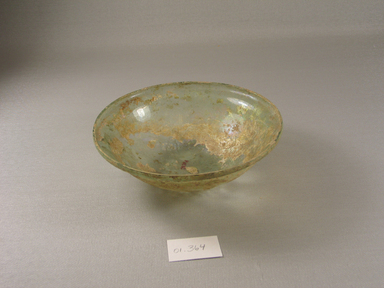 Roman. <em>Bowl of Gently Curved Blown Glass</em>, 4th century C.E. Glass, 1 7/8 x greatest diam. 6 in. (4.8 x 15.2 cm). Brooklyn Museum, Gift of Robert B. Woodward, 01.364. Creative Commons-BY (Photo: Brooklyn Museum, CUR.01.364.jpg)