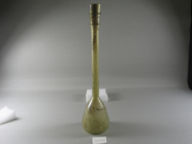 Roman. <em>Bottle of Blown Glass</em>, 4th-5th century C.E. Glass, 11 5/8 x Diam. 2 11/16 in. (29.5 x 6.8 cm)  . Brooklyn Museum, Gift of Robert B. Woodward, 01.373. Creative Commons-BY (Photo: Brooklyn Museum, CUR.01.373_view2.jpg)