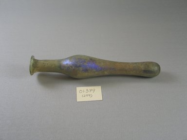 Roman. <em>Spindle-Form Unguentarium</em>, 4th century C.E. Glass, 1 1/4 x greatest length 6 13/16 in. (3.1 x 17.3 cm). Brooklyn Museum, Gift of Robert B. Woodward, 01.379. Creative Commons-BY (Photo: Brooklyn Museum, CUR.01.379.jpg)