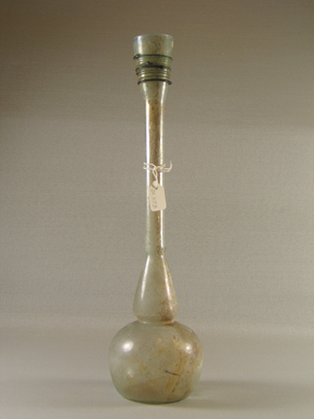 Roman. <em>Long-necked Bottle</em>, 4th-5th century C.E. Glass, 12 x Greatest diam. 3 1/8 in. (30.5 x 7.9 cm). Brooklyn Museum, Gift of Robert B. Woodward, 01.393. Creative Commons-BY (Photo: Brooklyn Museum, CUR.01.393_view1.jpg)