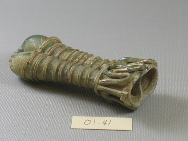 Roman. <em>Double Cosmetic Tube</em>, 4th-5th century C.E. Glass, 4 x 1 3/16 x 1 5/8 in. (10.2 x 3 x 4.1 cm). Brooklyn Museum, Gift of Robert B. Woodward, 01.41. Creative Commons-BY (Photo: Brooklyn Museum, CUR.01.41_view4.jpg)
