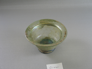 Roman. <em>Cup of Molded Blue-green Glass</em>, 1st-4th century C.E. Glass, 2 9/16 x Diam. 4 3/16 in. (6.5 x 10.6 cm). Brooklyn Museum, Gift of Robert B. Woodward, 01.441. Creative Commons-BY (Photo: Brooklyn Museum, CUR.01.441_top.jpg)