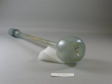 Roman. <em>Large, Long-necked Bottle of Plain Blown Glass</em>, 4th-5th century C.E. Glass, Greatest diam. 2 3/4 x 13 11/16 in. (7 x 34.7 cm). Brooklyn Museum, Gift of Robert B. Woodward, 01.470. Creative Commons-BY (Photo: Brooklyn Museum, CUR.01.470_view1.jpg)