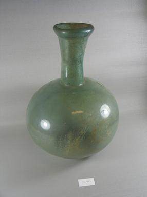 Roman. <em>Bottle of Plain Blown Glass</em>, 1st-early 8th century C.E. Glass, Height: 14 1/4 in. (36.2 cm). Brooklyn Museum, Gift of Robert B. Woodward, 01.474. Creative Commons-BY (Photo: Brooklyn Museum, CUR.01.474_view1.jpg)