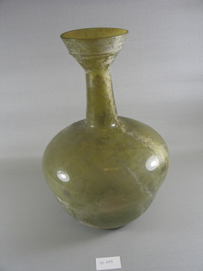 Roman. <em>Vase of Plain Blown Glass</em>, 3rd-early 8th century C.E. Glass, 13 x Diam. 3 15/16 in. (33 x 10 cm). Brooklyn Museum, Gift of Robert B. Woodward, 01.475. Creative Commons-BY (Photo: Brooklyn Museum, CUR.01.475_view1.jpg)