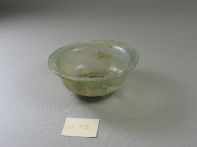 Roman. <em>Bowl</em>, 1st-2nd century C.E. Glass, 1 5/8 x Diam. 3 13/16 in. (4.2 x 9.7 cm). Brooklyn Museum, Gift of Robert B. Woodward, 01.73. Creative Commons-BY (Photo: Brooklyn Museum, CUR.01.73.jpg)