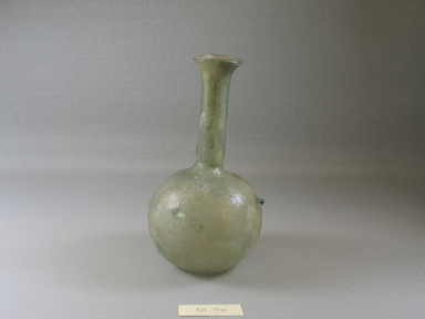 Roman. <em>Bottle of Blown Glass</em>, 3rd century C.E. (probably). Glass, Diam. 3 9/16 x 6 7/16 in. (9 x 16.4 cm). Brooklyn Museum, Gift of Robert B. Woodward, 01.76. Creative Commons-BY (Photo: Brooklyn Museum, CUR.01.76_view1.jpg)